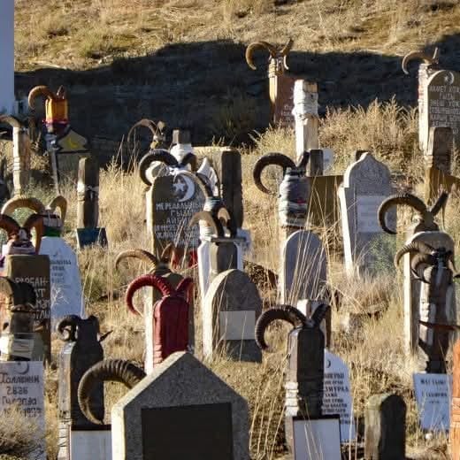 Nokhur cemetery goat horn gravestones Turkmenistan